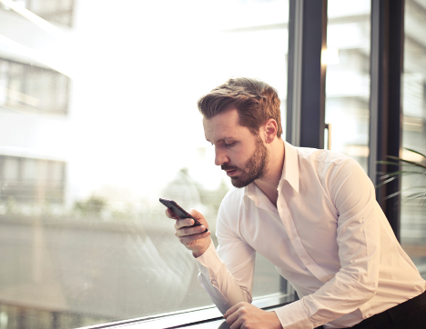 man looking at his phone