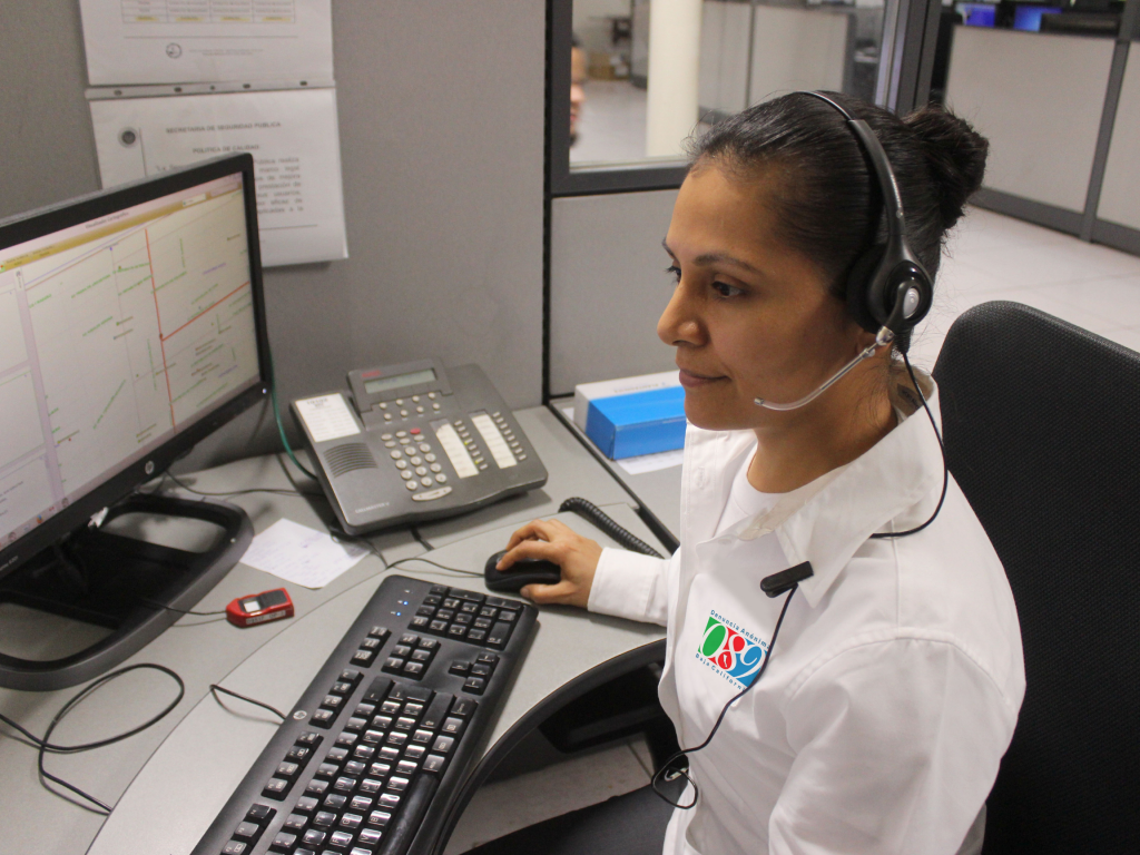 Woman using computer with headset