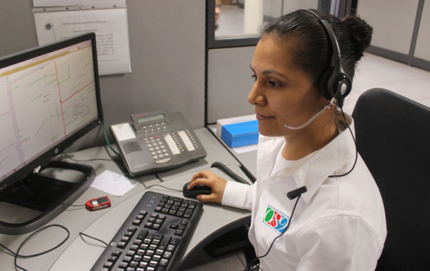 Woman using computer with headset