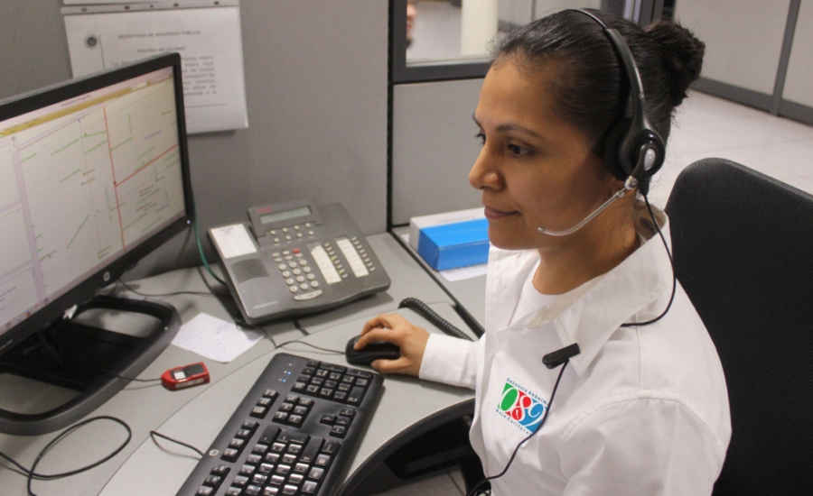 Woman using computer with headset